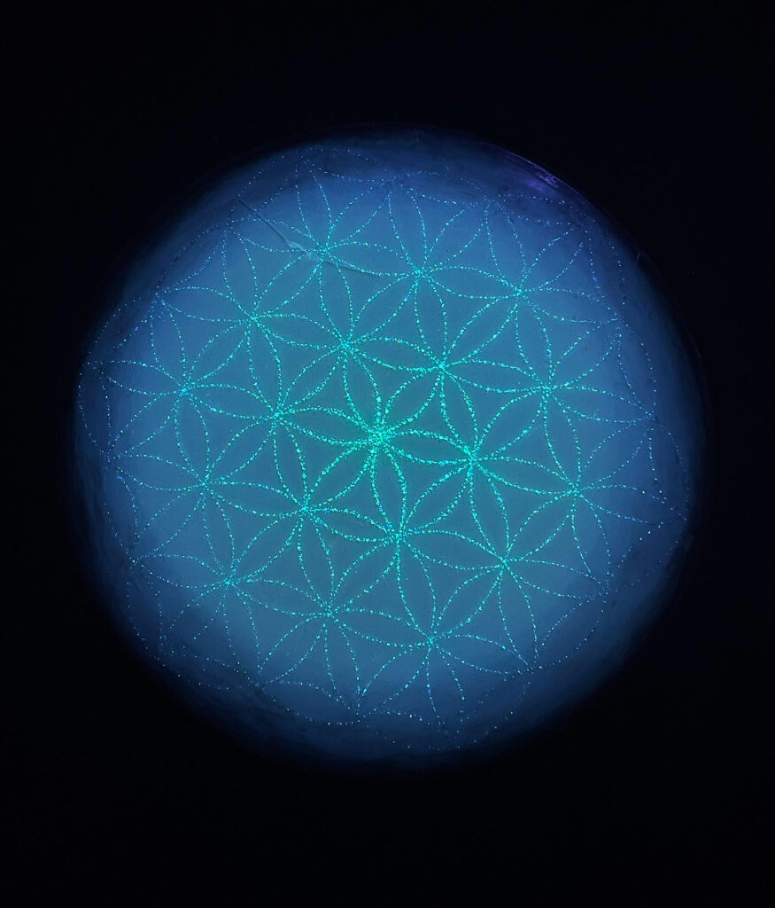 "Flower of Life", fluorescent painted crushed glass on resin, 27"x27" round panel